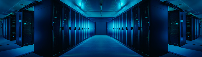 Wide-Angle Panorama Shot of a Working Data Center With Rows of Rack Servers. Blue Led Lights Blinking and Computers are Working. Dark Ambient Light.